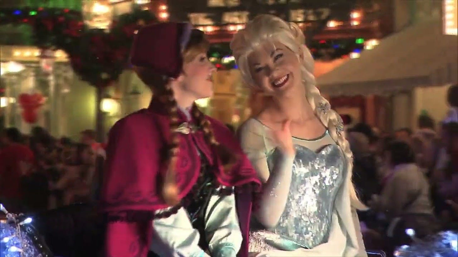 Anna and Elsa in Mickey's Once Upon a Christmastime Parade at Magic Kingdom. Image: Disney Parks on YouTube