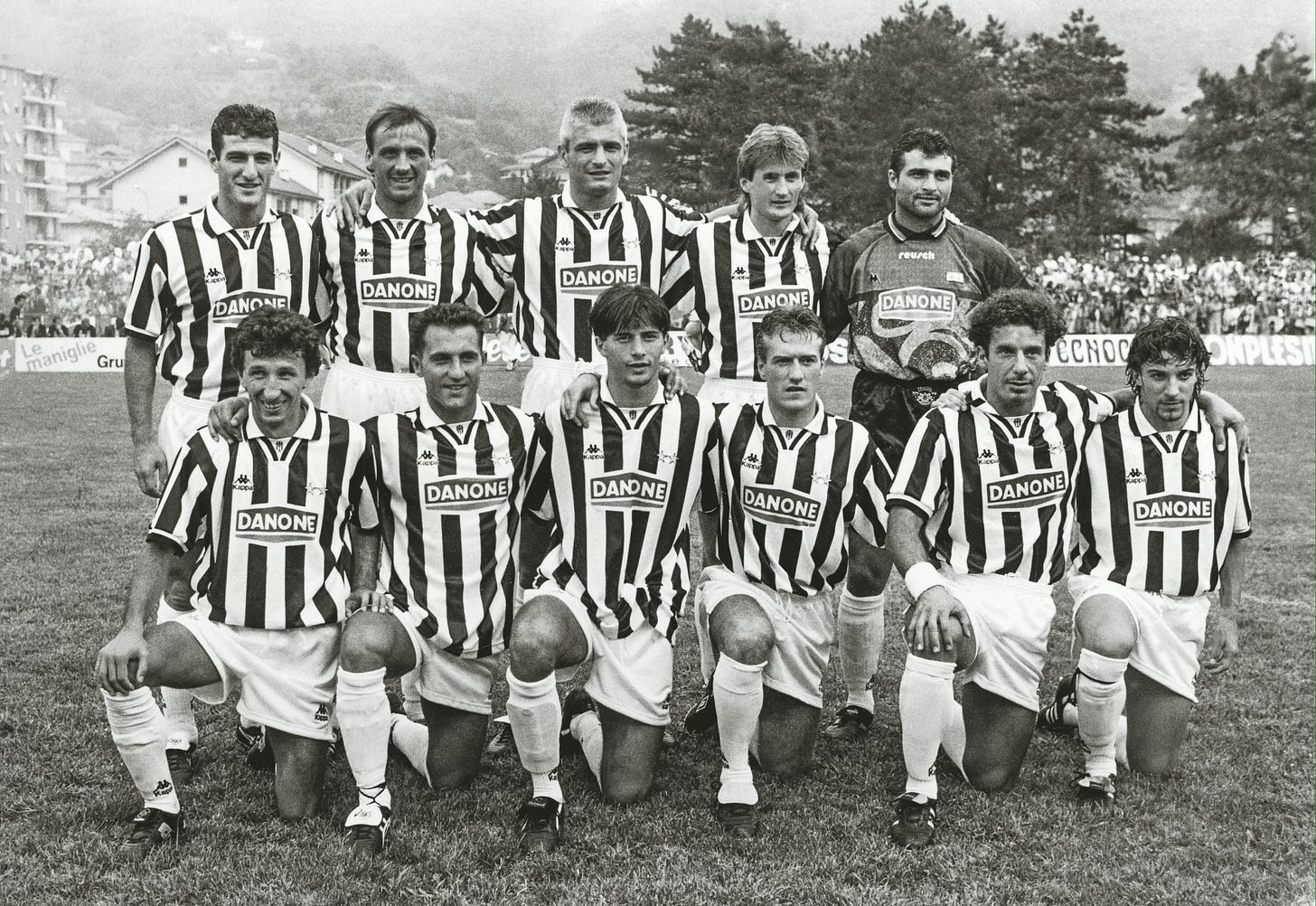 Juventus team photo in the early 1990s wearing Danone-sponsored jerseys, with players lined up before a match on a grass pitch.