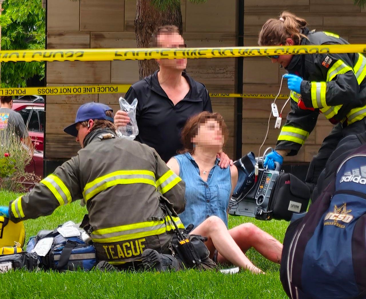 Boulder attack victims are treated on Sunday. CNN has added blur for reasons of privacy.