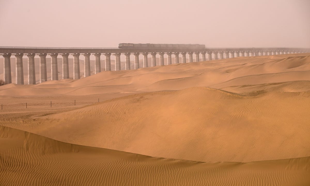 A train moves along the 825-kilometer Hotan-Ruoqiang railway in Northwest China's Xinjiang Uygur Autonomous Region in a test run. Photo: Courtesy of China State Railway Group A train moves along the 825-kilometer Hotan-Ruoqiang railway in Northwest China's Xinjiang Uygur Autonomous Region in a test run. Photo: Courtesy of China State Railway Group