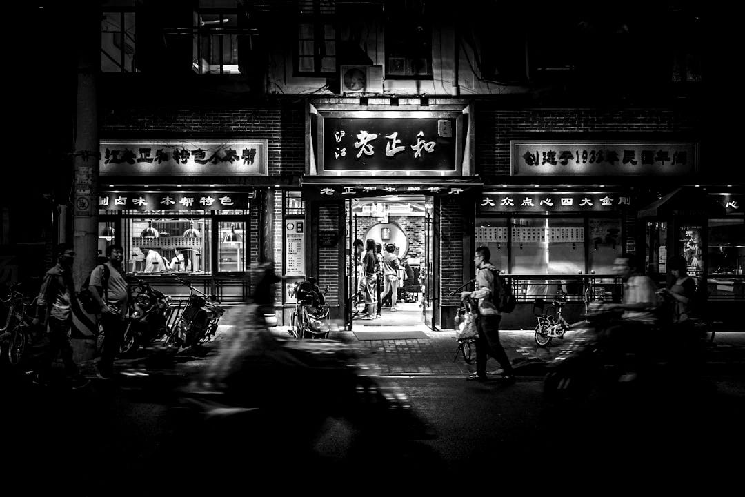 motorcycles and people passing by at night time motorcycles and people passing by at night time