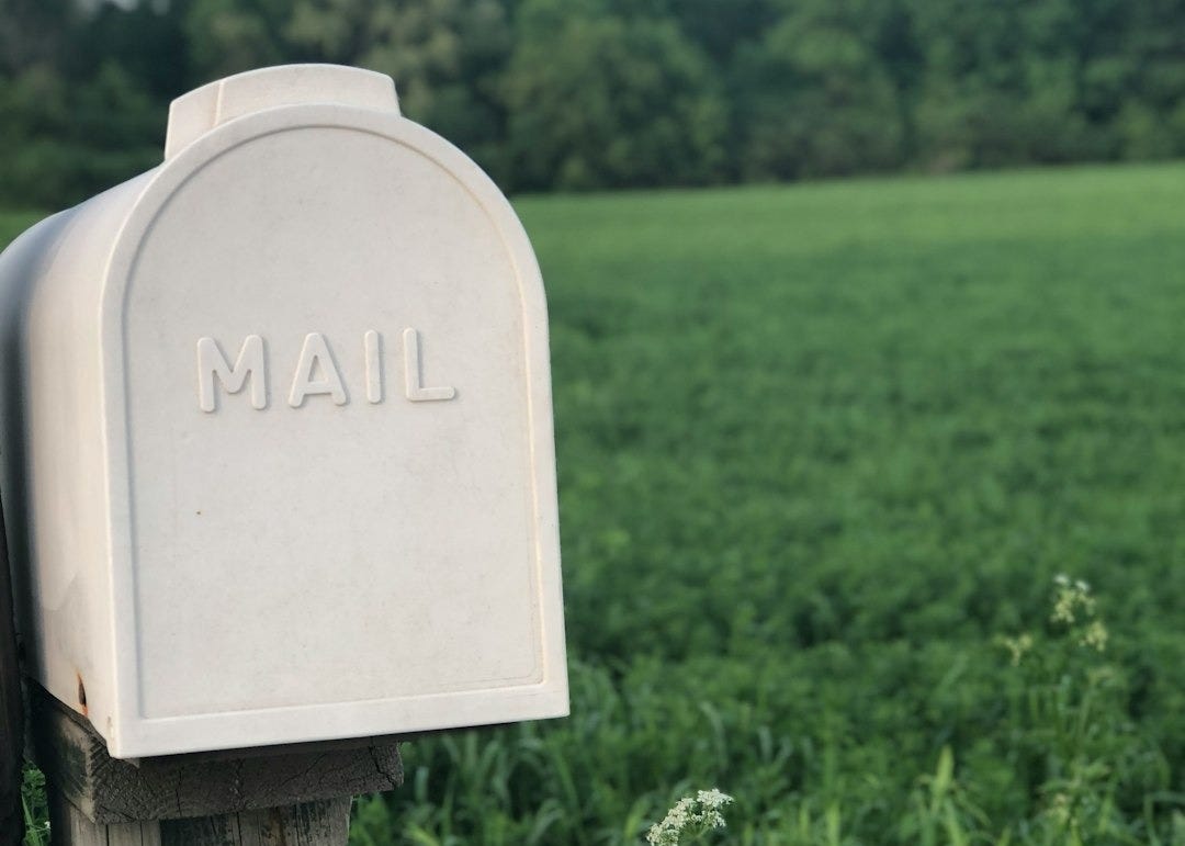 shallow focus photography of gray mailbox