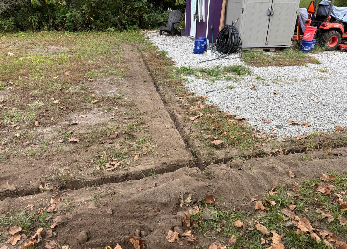 The trench leaving the well house splits to water both elderberry fields.