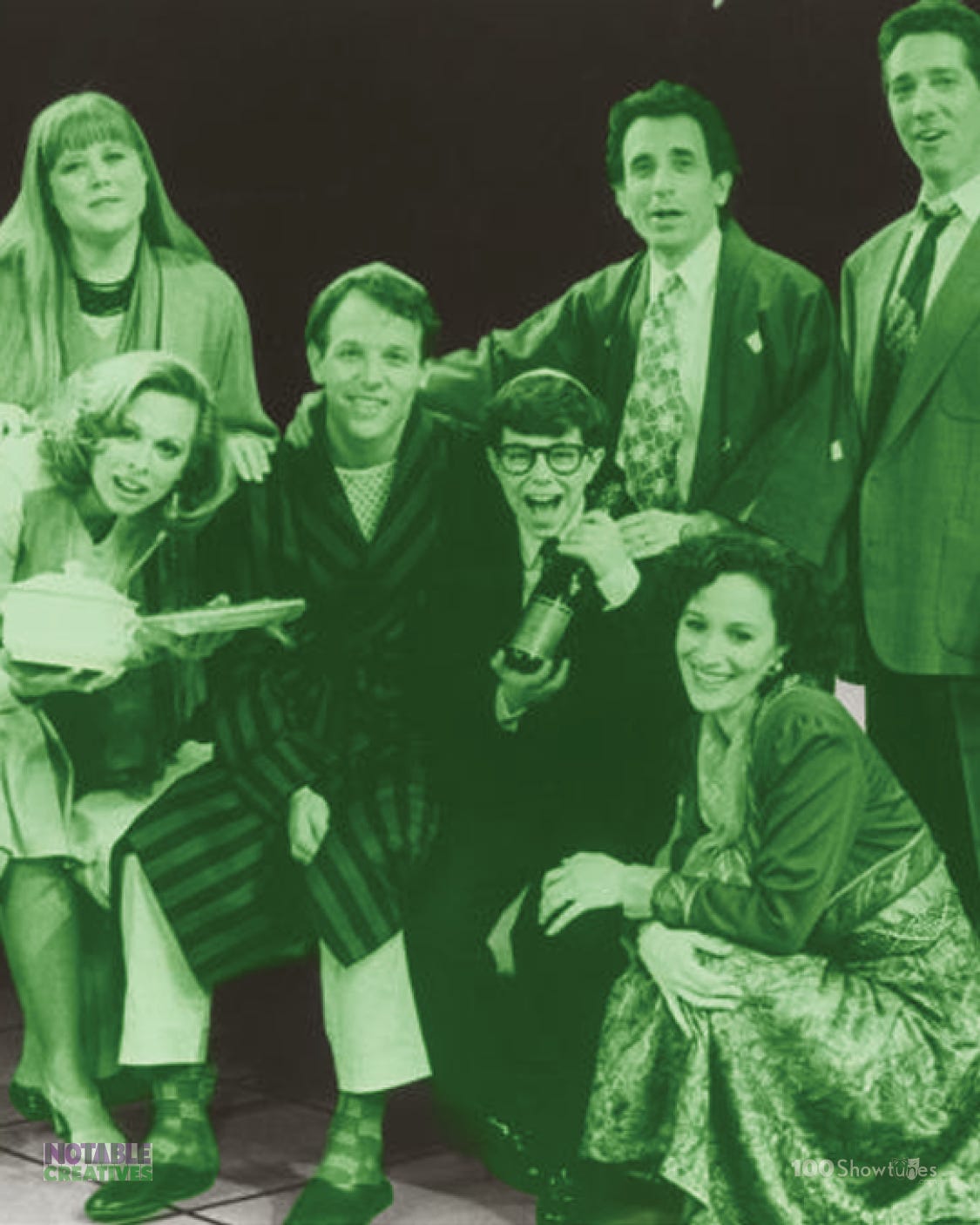 A tinted photo of Michael Rupert, Stephen  Bogardus, Chip Zien, Barbara Walsh, Heather MacRae, Carolee Carmello, and Jason Kaplan in the original Broadway production of FALSETTOS by William Finn and James Lapine.