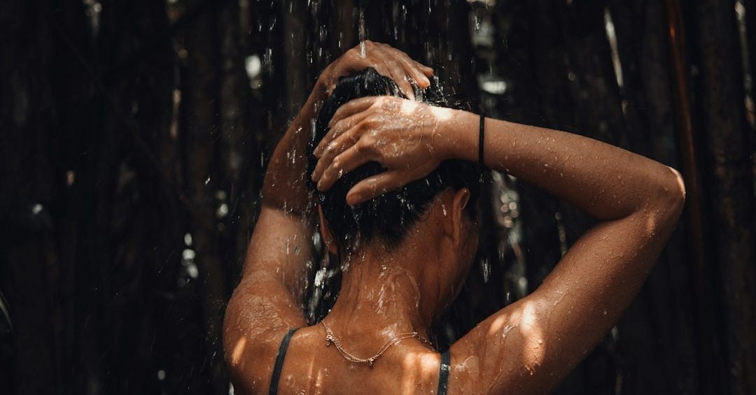 topless woman in black and white floral skirt