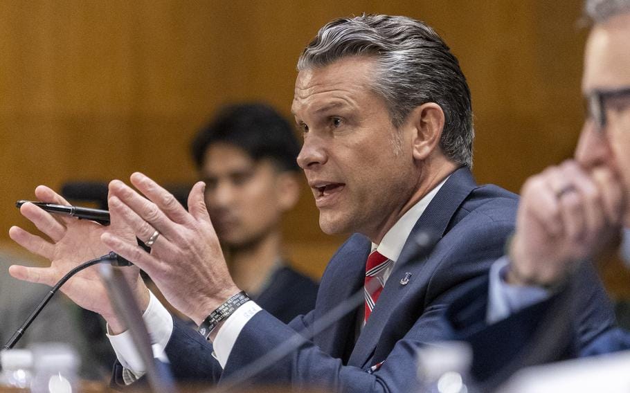 Pete Hegseth, seen from the side, gestures with his hands while speaking into a microphone during testimony in a congressional hearing room. Pete Hegseth, seen from the side, gestures with his hands while speaking into a microphone during testimony in a congressional hearing room.