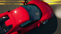 Video game gif. A Ferrari in Fortnite is being shown off as the camera pans on different angles of the racecar.