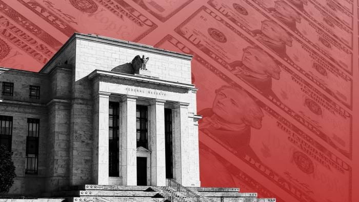 A montage of the Federal Reserve building and US dollar notes