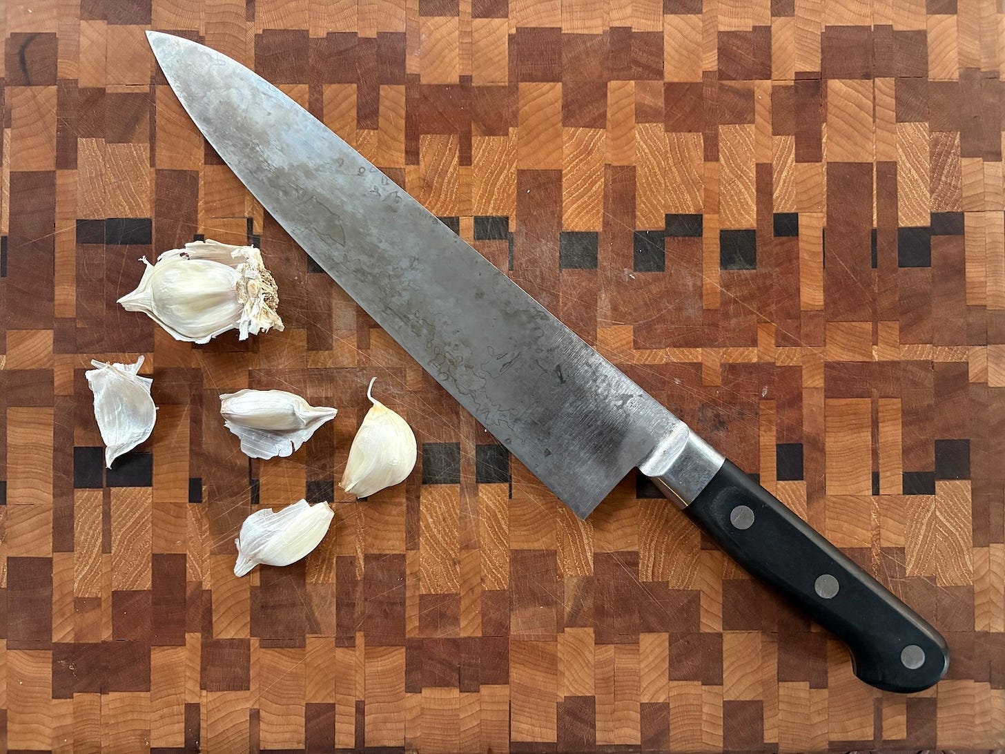 garlic, cutting board, and knife