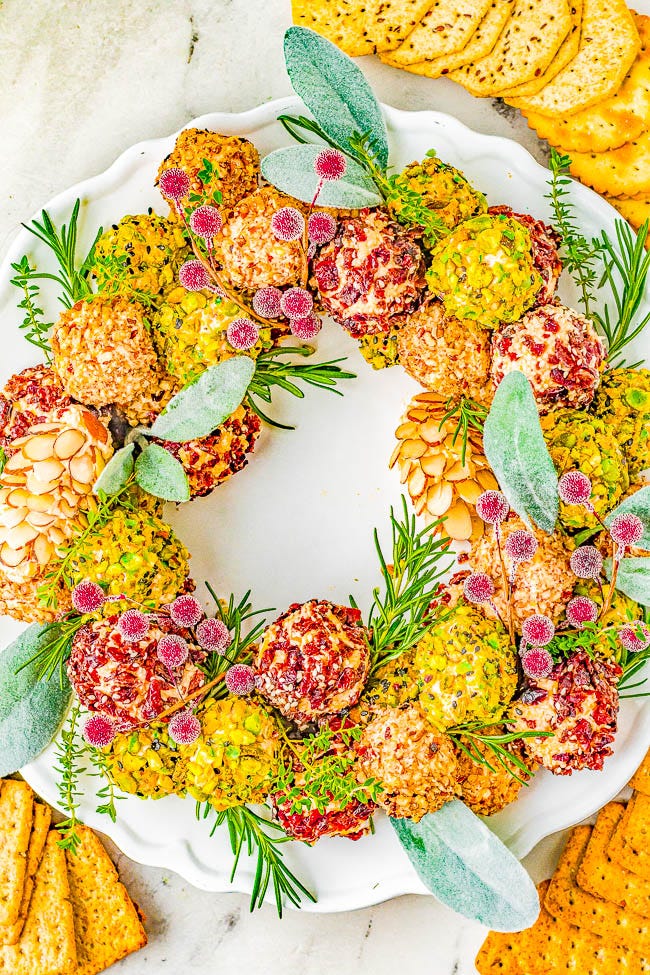 Christmas Cheese Ball Wreath — A delectable cheese ball mixture rolled in festive and colorful toppings and arranged into a wreath! A show-stopping presentation of wonderful cheese bites for your holiday parties and entertaining tables! EASY to make and can be made IN ADVANCE! No one can resist the allure of cheese! Christmas Cheese Ball Wreath — A delectable cheese ball mixture rolled in festive and colorful toppings and arranged into a wreath! A show-stopping presentation of wonderful cheese bites for your holiday parties and entertaining tables! EASY to make and can be made IN ADVANCE! No one can resist the allure of cheese!