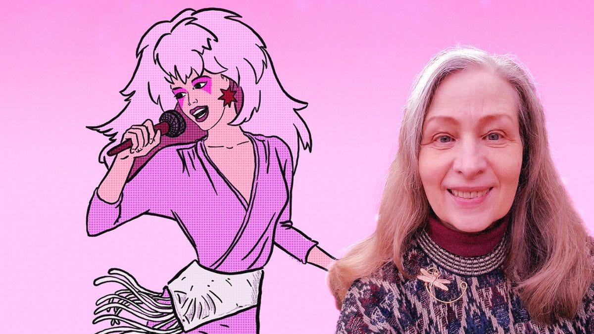 Portrait of Christy Marx in front of Jem illustration.