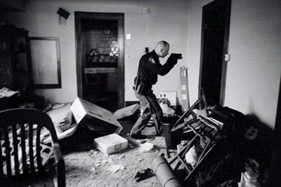 This picture by US photographer Anthony Suau, for Time won the World Press Photo of the Year 2008 award, it was announced by the organisers on 13 February 2009 in Amsterdam, The Netherlands. US Economy in Crisis: Following eviction, Detective Robert Kole must ensure residents have moved out of their home in Cleveland, Ohio, 26 March 2008. This picture by US photographer Anthony Suau, for Time won the World Press Photo of the Year 2008 award, it was announced by the organisers on 13 February 2009 in Amsterdam, The Netherlands. US Economy in Crisis: Following eviction, Detective Robert Kole must ensure residents have moved out of their home in Cleveland, Ohio, 26 March 2008.