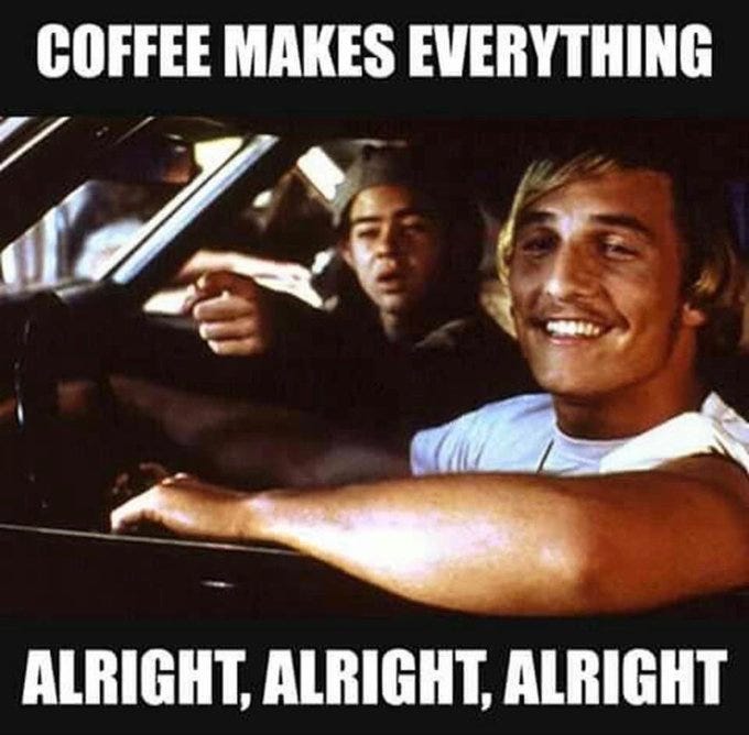 Two men in a car, one driving and pointing forward, the other smiling in the passenger seat. The car is moving, with visible windows and a dashboard. Text overlays read "COFFEE MAKES EVERYTHING ALRIGHT, ALRIGHT, ALRIGHT".