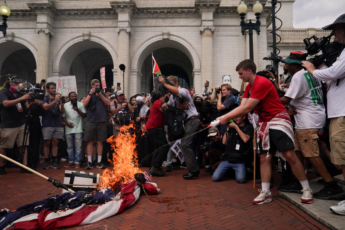 Harris condemns flag burning, protesters call it distraction from Gaza  crisis | Reuters