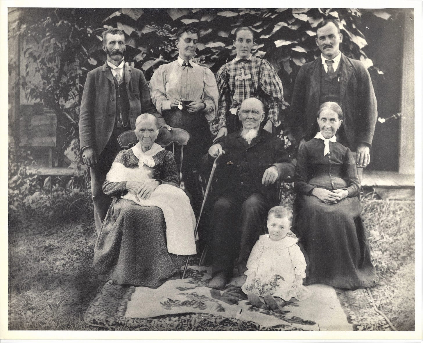 A group of people posing for a photo

Description automatically generated