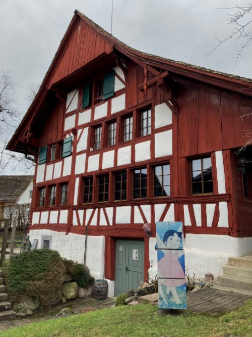 There is an old house with a puzzle of Heidi on the garden. It is the old town school, now Johana Spyri's Museum