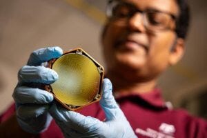Dr. Rupak Mahapatra, an experimental particle physicist, holds a TESSERACT detector. The highly sensitive devices, which are fabricated at Texas A&M University, are deepening the search for dark matter and have potential applications in quantum computing. Dr. Rupak Mahapatra, an experimental particle physicist, holds a TESSERACT detector. The highly sensitive devices, which are fabricated at Texas A&M University, are deepening the search for dark matter and have potential applications in quantum computing.