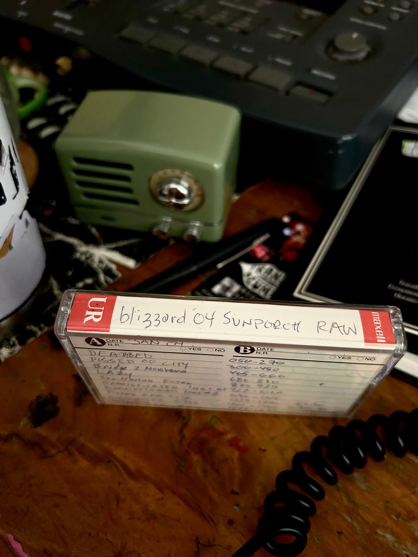 In an attempt to fetishize his analog gear, Faux Jean has included a photo of the cassette from which the song was transferred to digital, with the TASCAM 4 track recorder in the background.