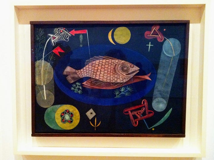Red-skinned fresh fish, a cooked whole fish, and a painting of a fish on a plate.