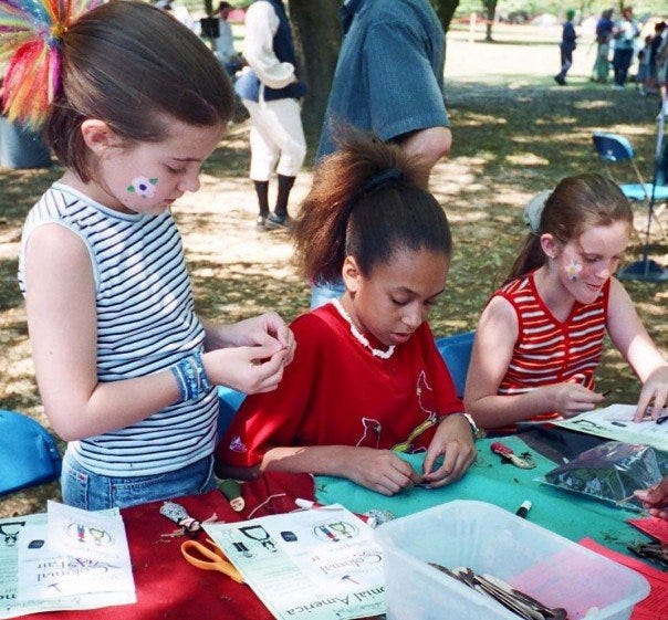 Children working on craft activity Children working on craft activity