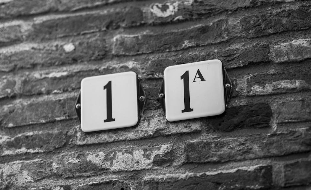 Street numbers on a brick wall Street numbers on a brick wall