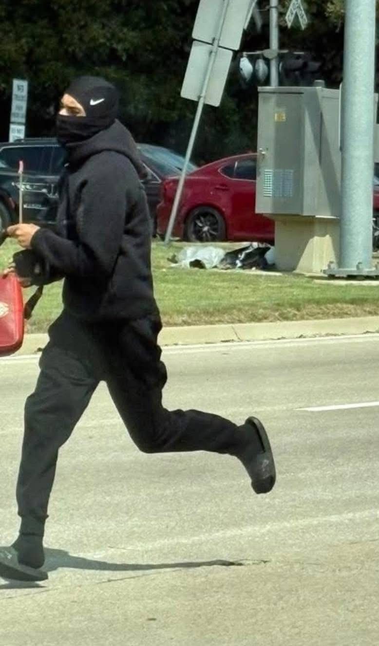 May be an image of 1 person and street