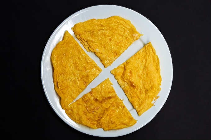 omelette cut into four pieces