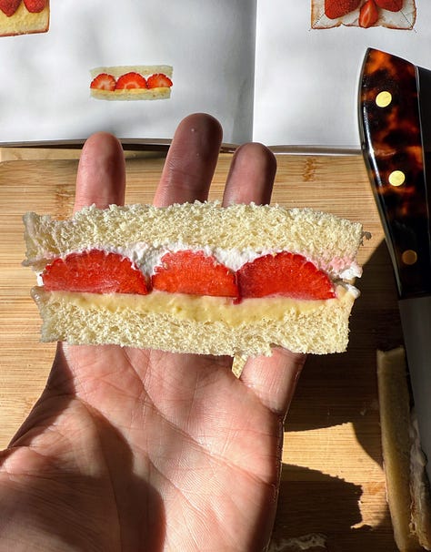 Strawberry sandwich being assembled