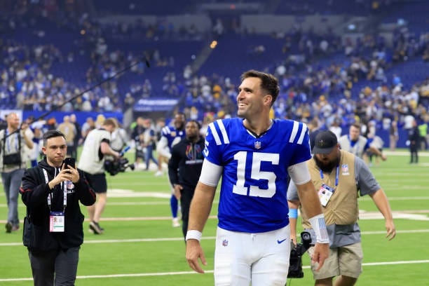 Joe Flacco of the Indianapolis Colts celebrates a win against the Pittsburgh Steelers as he leaves the field at Lucas Oil Stadium on September 29,...