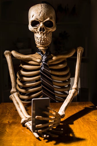 Died Waiting On Line Skeleton Sitting At Desk Holding Smart Phone Stock  Photo - Download Image Now - iStock