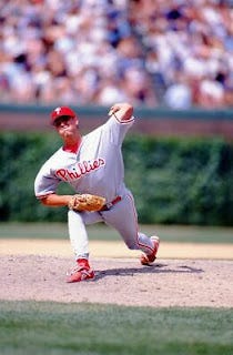 A baseball player throwing a ball

AI-generated content may be incorrect.
