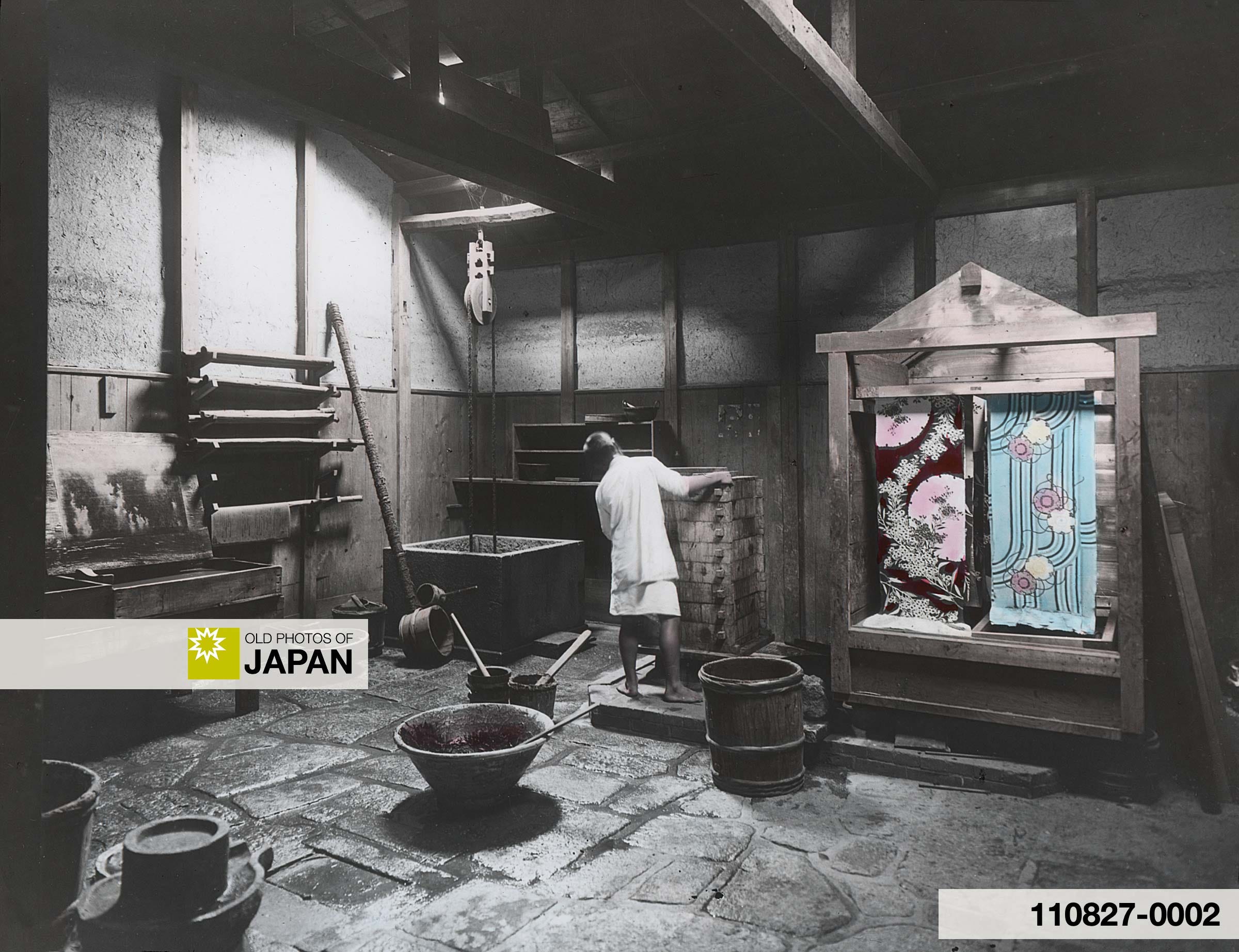 Japanese silk dyer at work in his workshop, 1900s