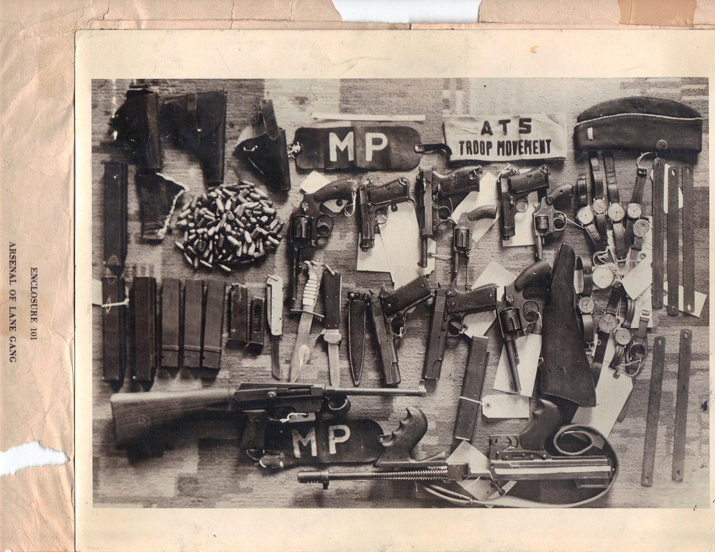 The formidable arsenal of the notorious Lane Gang, comprised of American and Canadian deserters who terrorized war-torn Italy, confiscated by the CID after their leader Werner Schmiedel's capture in 1944.