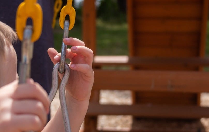 a little boy holding onto a pair of scissors a little boy holding onto a pair of scissors
