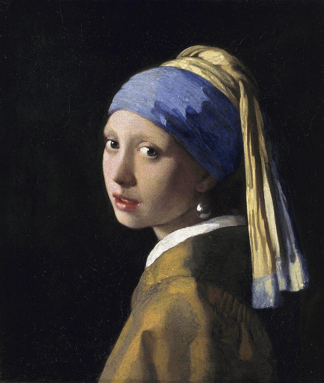 Girl in a turban turning to look over her shoulder Girl in a turban turning to look over her shoulder