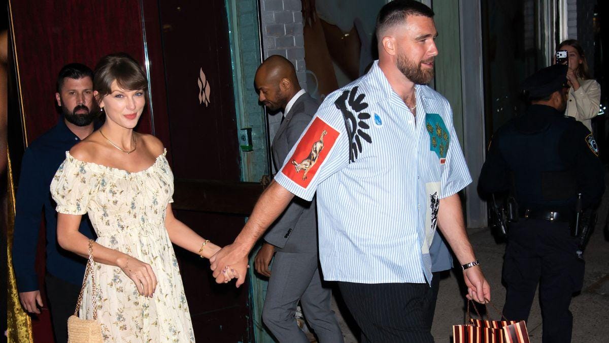 Photo of Taylor Swift and Travis Kelce Photo of Taylor Swift and Travis Kelce