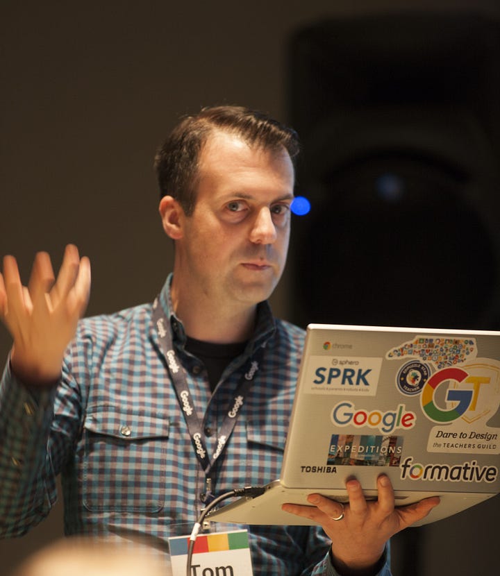 Four images of Tom Mullaney presenting and collaborating with collagues.