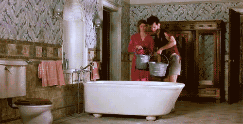 Gif of water being poured into a bathrub by Walter and Anna and then falling through the floor to smash into smithereens on the floor below