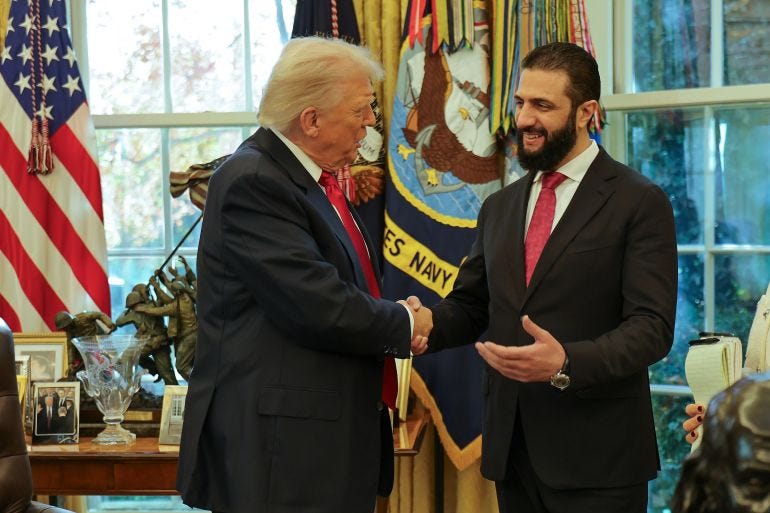 In this photo released by Syrian Presidency press office, President Donald Trump, left, shakes hands with Syria's President Ahmad al-Sharaa, at the White House in Washington, Monday, Nov. 10, 2025. (Syrian Presidency press office via AP) In this photo released by Syrian Presidency press office, President Donald Trump, left, shakes hands with Syria's President Ahmad al-Sharaa, at the White House in Washington, Monday, Nov. 10, 2025. (Syrian Presidency press office via AP)