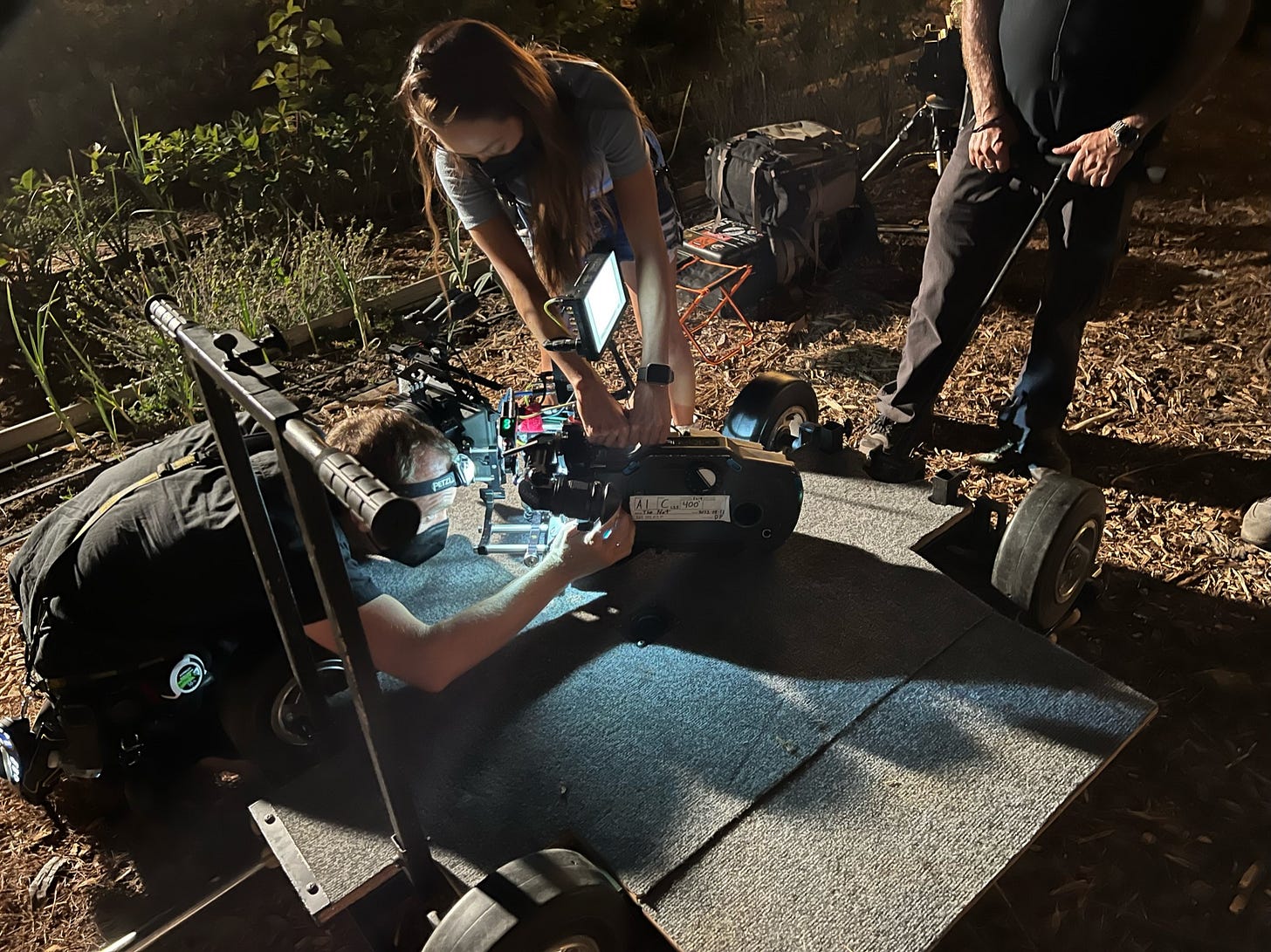 Andrew Parrotte and Gemini Elisabet Davis check the gate. David J. Schweitzer directs the camera operation on the set of The Not by Courtney Hoskins