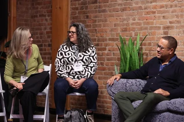 Meghan Daum hosting an Unspeakeasy retreat weekend in New York City with attendees in conversation around a table