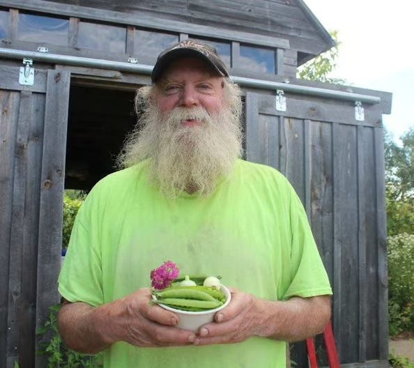 photo of Brian Bennett holding a bowl of produce
