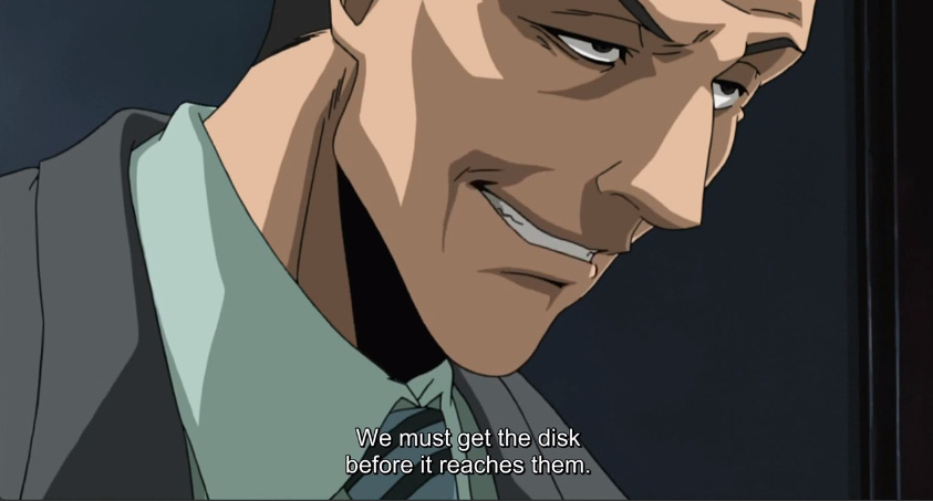 An evil looking Kageyama, who says "We must get the disk before it reaches them."