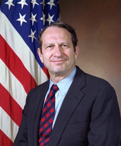 A person in a suit and tie

Description automatically generated with low confidence