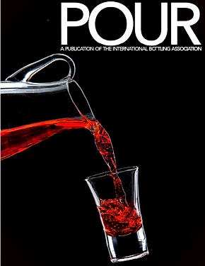 Portfolio concept image of a magazine cover showing a pitcher pouring red beverage into a shot glass 
