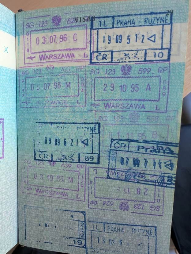 A passport with stamps on it

AI-generated content may be incorrect.