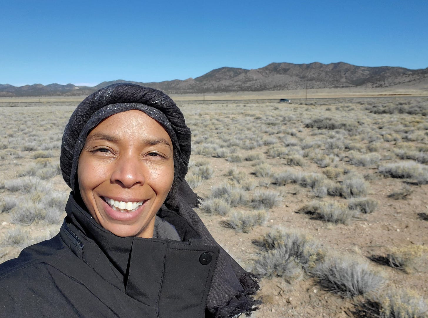 Lanita standing in the middle of the high desert in Southern Utah.
