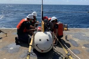 Preparing the Scripps Undersea Electromagnetic Source Instrument (SUESI) for deployment. SUESI transmits an alternating current while being deep-towed behind the ship. Ocean-bottom electromagnetometers (receivers) on the seafloor record how the signal is influenced by subsurface structures.