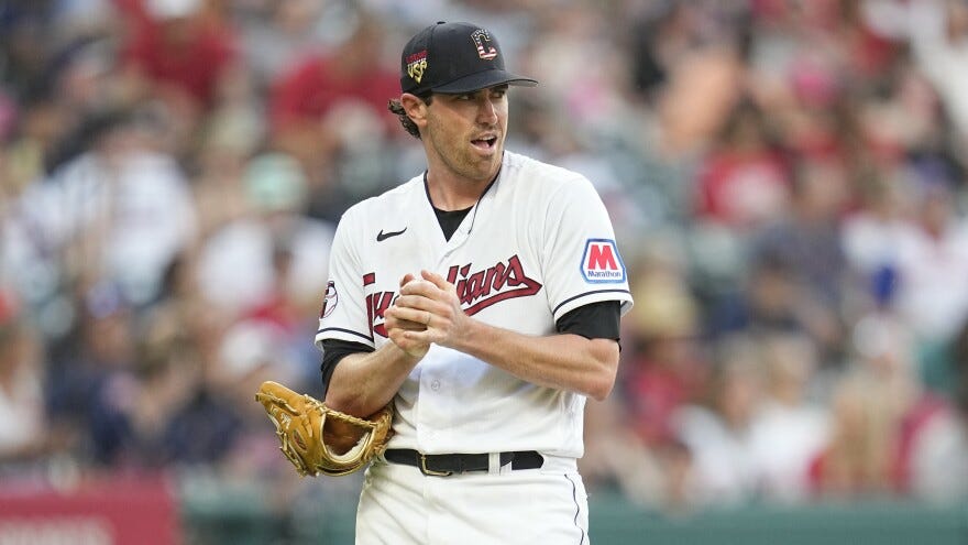 Cleveland Guardians starting pitcher Shane Bieber watches as Atlanta Braves' Ozzie Albies runs the bases after hitting a home run in the fifth inning of a baseball game Tuesday, July 4, 2023, in Cleveland. 