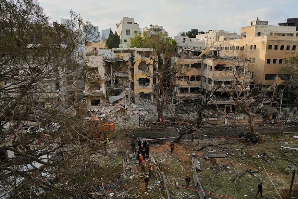 Rescue team work at the site where a missile launched from Iran struck Tel Aviv, occupied Palestine, Monday, June 16, 2025. (AP Photo/Baz Ratner) Rescue team work at the site where a missile launched from Iran struck Tel Aviv, occupied Palestine, Monday, June 16, 2025. (AP Photo/Baz Ratner)